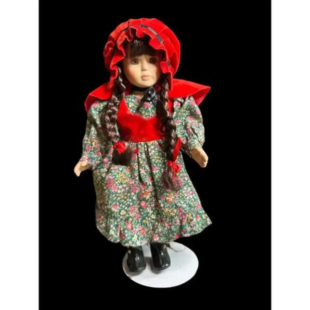 Doll 14”Little Red Riding Hood porcelain display doll in good condition with sta